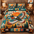 Mountain Sunrise Eagle Spirit quilted 3-piece bedding set on a made bed in a warmly lit bedroom