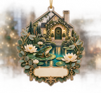 One christmas ornament with an emerald frog, turquoise cottage pond, layered lily pads, ivory lotus flowers, dragonflies, brass keys, eucalyptus and a blank cream name plaque.