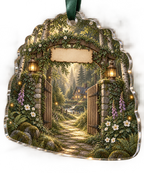 One christmas ornament with a welcoming woodland cottage gate formed by mossy stone pillars and a timber pergola, a winding sunlit forest path leading toward a warm distant home, ferns, birch trees, white anemones, violet foxgloves, amber fireflies, two brass lanterns and a blank parchment name plaque.