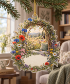 One christmas ornament with a sunlit wildflower meadow, woven-willow reading arch and blank ivory-linen name plaque.