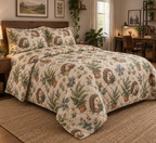 Quilted bedding set and matching shams with hedgehogs reading among ferns and books.