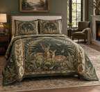 One quilt and two matching shams with deer-pair and fern folio artwork on a bed.