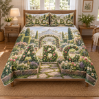 One quilt and two matching shams printed with floral A B C topiary forms, raised garden beds, a stone path and a distant glasshouse.