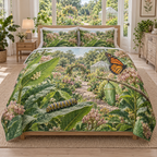 A three-piece quilted bedding set printed with butterfly eggs, a striped caterpillar, green chrysalis and orange butterfly in a layered garden.