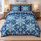 Crystal Snowflake Lattice 3-Piece Quilted Bedding Set. One quilt and two shams with flat printed icy rosettes and branching snowflakes.