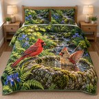 Cardinal Boulder Bath Woodland Quilted Bedding Set. Flat printed male and bathing female cardinals at a mossy boulder basin with irises and woodland stream.