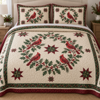 Quilt and two shams with four red cardinals around a holly wreath and central patchwork star, visible meandering quilting