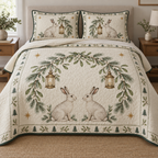 One lightweight quilt and two shams with printed winter hares, mistletoe arch and lanterns, green binding and visible meandering quilting