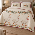 One ivory quilt and two matching shams with three printed white geese, rosemary orange garland, cranberry binding and dense quilting