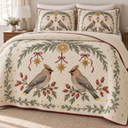 One ivory lightweight quilt and two matching pillow shams with printed waxwing pairs, cedar dried lemon arch and ochre stars, cranberry binding and cream reverse fold