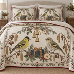 One ivory quilt and two shams with Eurasian siskin male female pair, navy gift, apple slices cedar holly arch and ochre bells, cranberry binding cream reverse