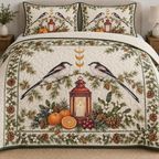 One ivory quilt and two matching shams with paired long-tailed tits tangerine lantern larch juniper mistletoe ochre moons forest green binding and sewn meandering quilting