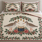 One ivory quilt and two matching shams with paired common redshanks navy toy drum pomegranate halves spruce bay holly ochre bells cranberry binding sewn meandering quilting