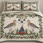 One ivory quilt and two matching shams with paired black-tailed godwits cranberry toy sailboat navy sail pear halves fir mistletoe holly snowflake baubles green binding sewn quilting