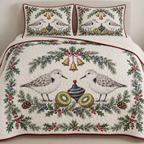 One ivory quilt and two matching shams with paired sanderlings navy toy spinning top kiwi halves fir juniper holly ochre bells cranberry binding sewn quilting