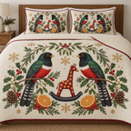 Two illustrated collared trogons frame a cranberry toy rocking giraffe with ochre spots and navy rocker, with orange halves, cedar cones, holly, mistletoe and ochre snowflakes on ivory. Flat printed Christmas artwork with cranberry binding. Includes one quilt and two matching pillow shams. Visible sewn quilting and fabric drape.