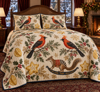 Satinbird Starfruit Rocking Numbat quilt and two matching shams flat printed orange-red black-wing birds striped brown rocking numbat starfruit navy binding sewn channels in warm Christmas bedroom.