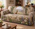 Full fitted sofa cover printed with a rabbit by an arched garden window among meadow flowers in a cottage office.