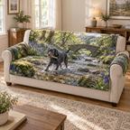 A quilted sofa protector printed with a black Labrador carrying a stick through a bluebell woodland creek.