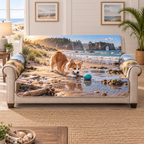 A quilted sofa protector printed with a playful corgi and turquoise ball beside a tidepool, dunes and distant sea arch.