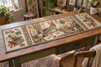 Quilted table runner printed with a rabbit hobby artist, botanical cards and pressed fern panels.