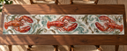 One table runner with original Lobster Welcome Key optical-depth print.