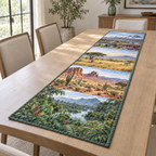 A rectangular table runner printed with rainforest, desert, grassland and tundra landscape windows.