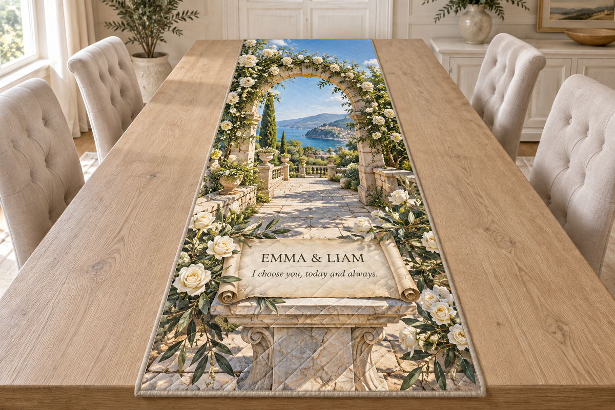 Example EMMA & LIAM and I choose you, today and always. on a printed parchment scroll and marble pedestal, with white roses, courtyard arch and sea hills.