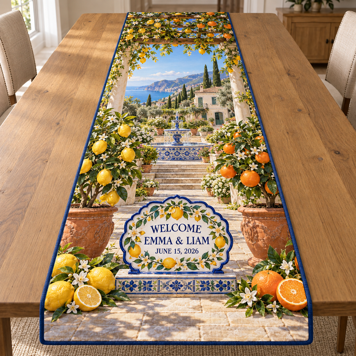 Example WELCOME / EMMA & LIAM / JUNE 15, 2026 white majolica-style welcome tablet cobalt citrus border tiled plinth lemon and orange trees terracotta pots pergola fountain Mediterranean garden villa coastal hills sky.