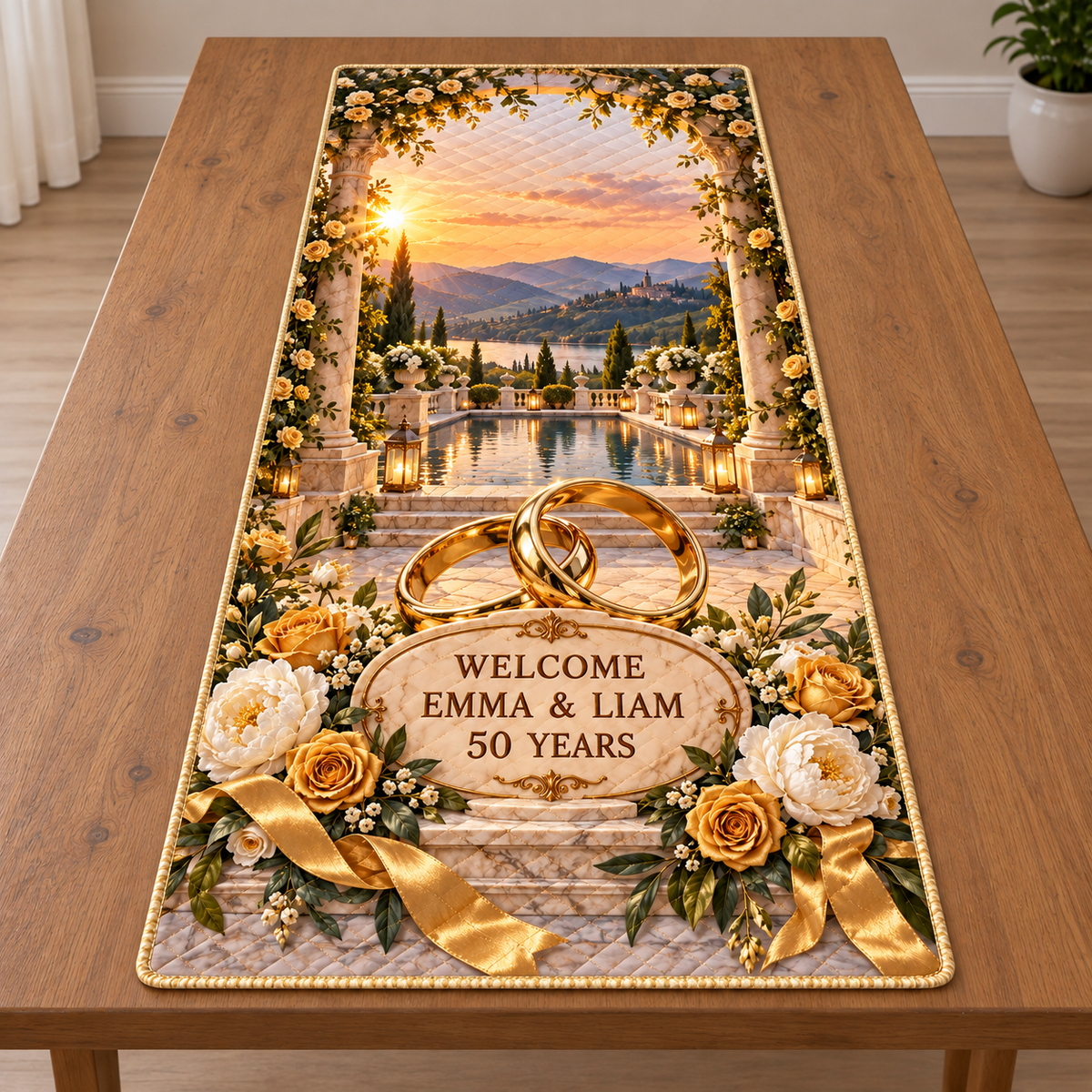 Example WELCOME / EMMA & LIAM / 50 YEARS ivory oval plaque before two intertwined golden rings, roses peonies olive ribbon marble plinth stone loggia reflecting pool terrace hills evening sky.