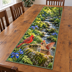 Cardinal Boulder Bath Woodland Table Runner. Flat printed male and bathing female cardinals, mossy boulder basin, blue irises and woodland stream.
