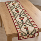 One ivory quilted table runner with four printed nutcracker musicians in leafy diamond panels, cranberry binding and visible quilt channels