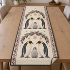 One ivory quilted runner with two printed emperor penguin families, cranberry fir snowflake arches, green binding and dense quilting