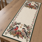 One ivory quilted table runner with four Eurasian bullfinches, cranberry gifts, orange slices fir rosehip arches and ochre snowflake stars, green binding