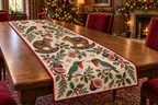 Tody Fig Rocking Agouti quilted cotton runner four emerald scarlet-throat red-bill birds two brown tail-less rocking agoutis purple figs cranberry binding sewn channels in warm Christmas dining room.