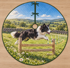 Flat printed meadow agility artwork with one border collie jumping a low hurdle, with receding weave poles and rolling hills.