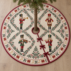 One ivory quilted Christmas tree skirt with four printed nutcracker musicians, leafy panels, cranberry binding, center opening and three ties