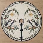 One ivory quilted tree skirt with two printed puffin pairs under holly juniper star arches, navy binding, center opening and three ties