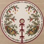 One ivory quilted circular tree skirt with four goldcrests, navy gifts, lemon slices fir redcurrant sprigs and ochre stars, cranberry binding centered opening slit and ties