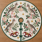 Four illustrated red-legged seriemas with shaggy forehead crests and red bills frame two cranberry toy rocking anteaters with ochre saddles and navy rockers, apple halves, cedar, holly, mistletoe and ochre stars on ivory with green binding. Flat printed Christmas artwork. Includes one circular tree skirt with center opening and tie closure. Visible sewn quilting and continuous radial opening.