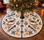 Forktail Orange Rocking Springhare tree skirt four black white long-tailed birds two brown thick-tail rocking springhares oranges green binding sewn channels centered opening radial slit three ties in Christmas room.