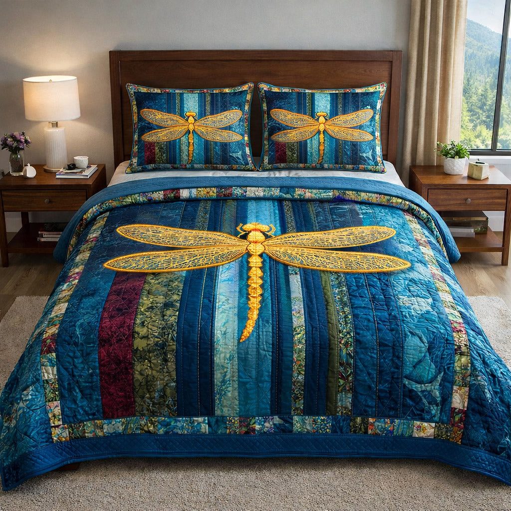 Mystic Wings Dragonfly Blue quilted 3-piece bedding set on a made bed with two matching pillow shams