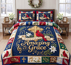 Navy Cardinal Amazing Grace quilted 3-piece bedding set on a made bed in a warmly lit bedroom