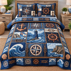 Navy Compass Coastal Patchwork quilted 3-piece bedding set on a made bed in a warmly lit bedroom