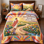 New Beginning quilted 3-piece bedding set on a made bed with two matching pillow shams