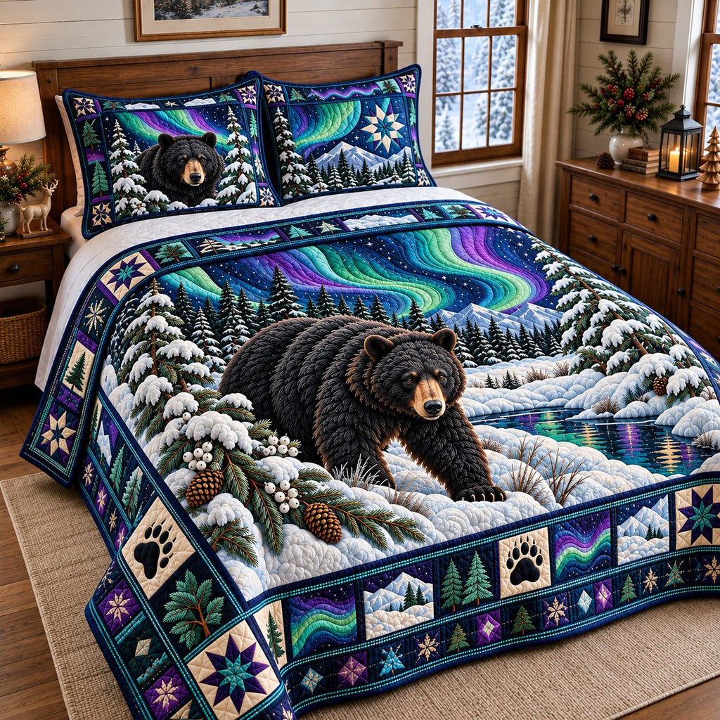 Northern Lights Black Bear quilted 3-piece bedding set on a made bed with two matching pillow shams