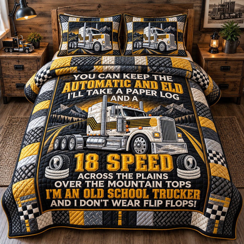 Old School Trucker quilted 3-piece bedding set on a made bed with two matching pillow shams