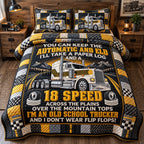 Old School Trucker quilted 3-piece bedding set on a made bed with two matching pillow shams
