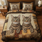 Pawfect Gang Kittens quilted 3-piece bedding set on a made bed with two matching pillow shams