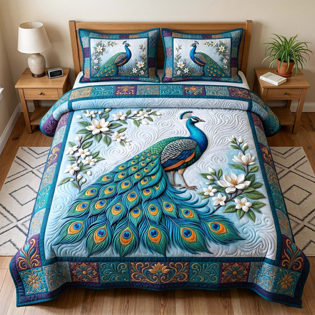 Peacock Majesty Blue quilted 3-piece bedding set on a made bed with two matching pillow shams
